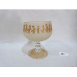 A frosted glass goblet with gilt decoration of children. 5¼' high