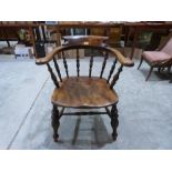 A Victorian elm smoker's bow elbow chair