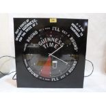 A 'Guinness Time' illuminated advertising wall clock. 17' high