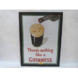 A framed 'There's Nothing Like a Guinness' advertising print. 19' x 14'