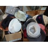 A large quantity of lady's hats, the lot to include a tin cabin truck