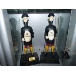 Two Guinness iron figural moneyboxes. 14' high