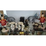 A shelf of Coalport Guinness figures and other memorabilia