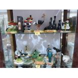 A collection of Guinness themed resinous and ceramic figures to include some Carlton Ware examples