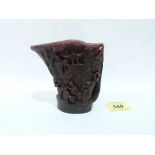 A Chinese carved libation cup. Seal mark to base. Possibly horn. 4¼' high