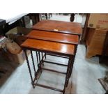 A nest of three mahogany occasional tables on barleytwist spider legs. 28½' high