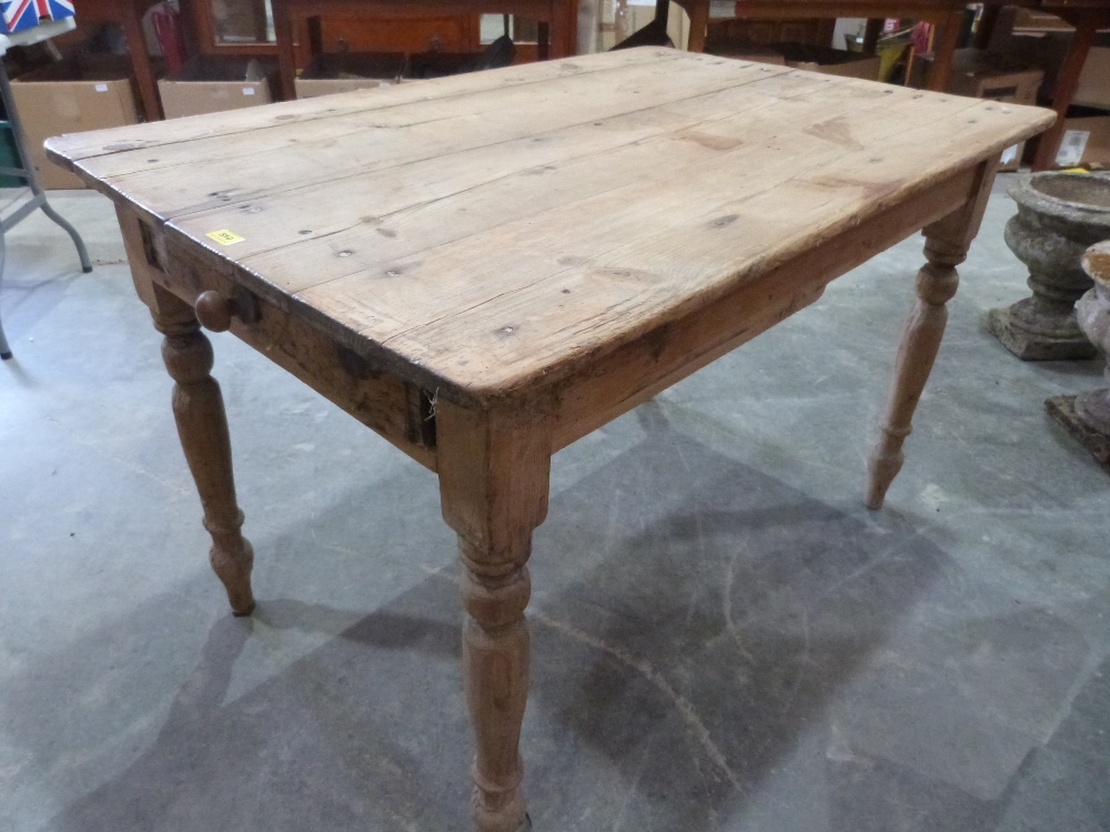 A Victorian pine kitchen table with frieze drawer. 47½' long