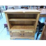 A joined light oak bookcase, made by Oakwood Furniture of Chester. 36' wide