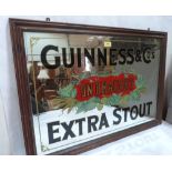 A Guinness on Draught advertising pub mirror. 22' x 32'