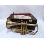 A 19th century brass cornet with box and music