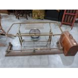 A brass coffee table frame; a brass fender; a sewing machine and parcel scales