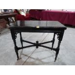 A Victorian ebonised card table. 34' wide