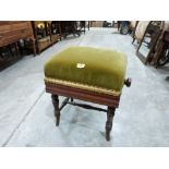 A Victorian walnut piano stool