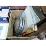 A quantity of car manuals and two Morris 1000 hubcaps