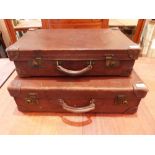 Two vintage leather cases, the larger 26' wide