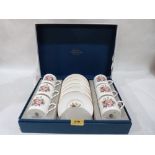 A boxed Royal Worcester set of six coffee cans and saucers