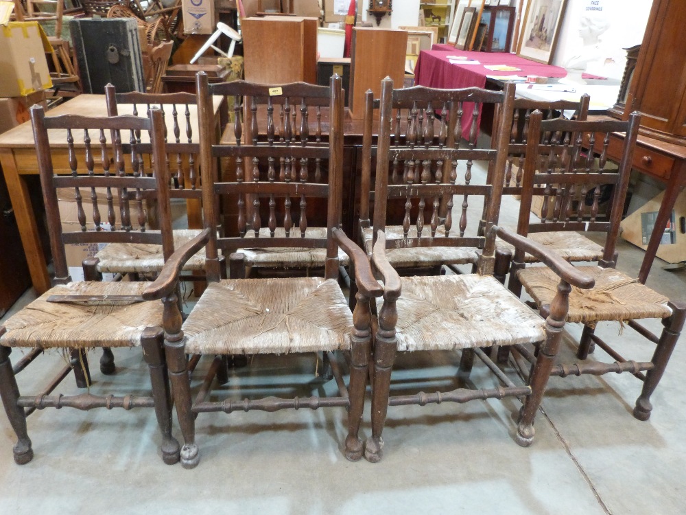 A set of eight spindleback country chairs, the rush seats in poor condition, the set to include