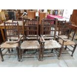 A set of eight spindleback country chairs, the rush seats in poor condition, the set to include
