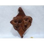 A French carved wood sock and buskin drama wall plaque, incised inscription 'Vita Comoedia'