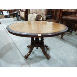 A Victorian walnut and inlaid loo table on quadripartite support. 46' long