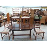 An extending dining table and set of six ladderback chairs