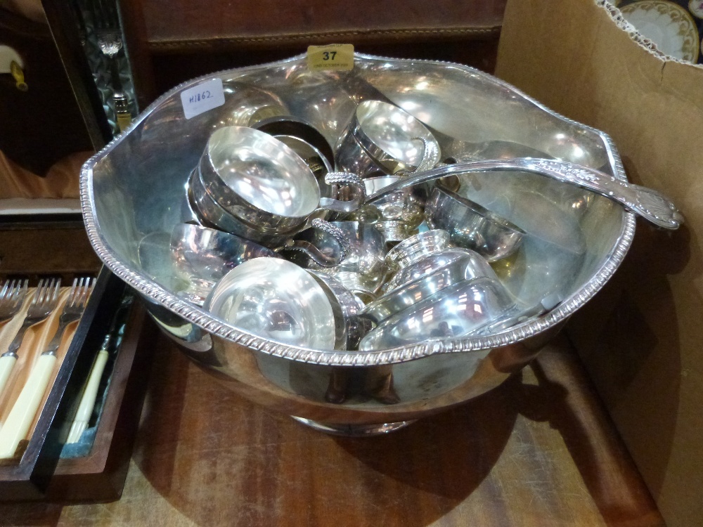 A punchbowl and other platedware