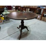 A 19th century oak tripod table, the snap-top. 33' diam