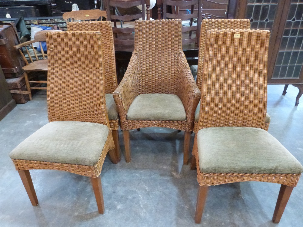 A set of five wicker dining chairs