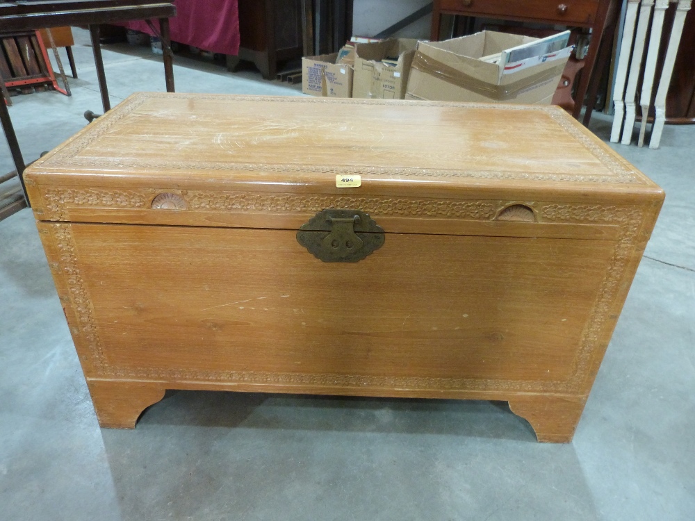 An Oriental camphorwood blanket chest. 40' wide