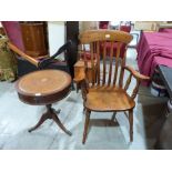 A lath back elbow chair and a drum occasional table