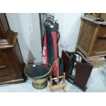 A dressing table mirror, small easel, golf clubs and a coal bucket