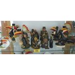 A collection of Royal Doulton Guinness figures and resinous figures