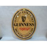 A Guinness enamel advertising sign. 24' high