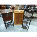 A light oak wall cabinet; a mahogany washstand and an oak three tier cake stand