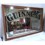 A Guinness advertising pub mirror. 22' x 34'