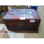 A Chinese carved camphorwood box. 12' wide