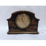 An early 20th century japanned mantle clock with French drum movement. 6¼' high