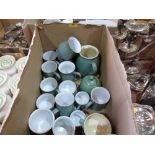 A box of green Denby crockery