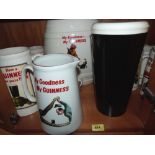 11 Guinness pub water jugs; a Guinness barrel and a ceramic pint of Guinness bar ornament