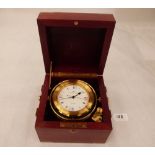 A quartz nautical gimbal mounted clock in mahogany and brass mounted case, the dial signed Matthew