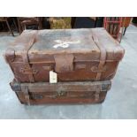 Two vintage canvas and leather cases, one containing a quantity of childrens' books