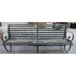 An iron and wood slatted garden seat. 84' long. (Rot to slats)