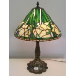 A brass based Tiffany style table lamp