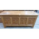 A joined light oak carved blanket chest. 54½' wide