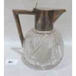 A Victorian cut glass and silver mounted claret jug. London 1896. 6½' high. (Hinge pin to lid