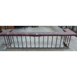 A 19th century wrought iron inglenook club fender with buttoned red leather top. 98' wide