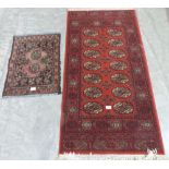 A red ground rug 53' x 27' and a prayer mat