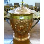 A Victorian Arts and Crafts planished copper and brass coal bin with domed cover. 18' high