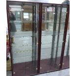 A pair of glazed display cabinets