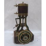 A brass reciprocating single cylinder gas engine. 15' high